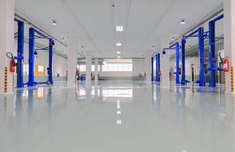 Picture of a epoxy garage floor. The type of resin is solid epoxy installation white with gloss finish. 